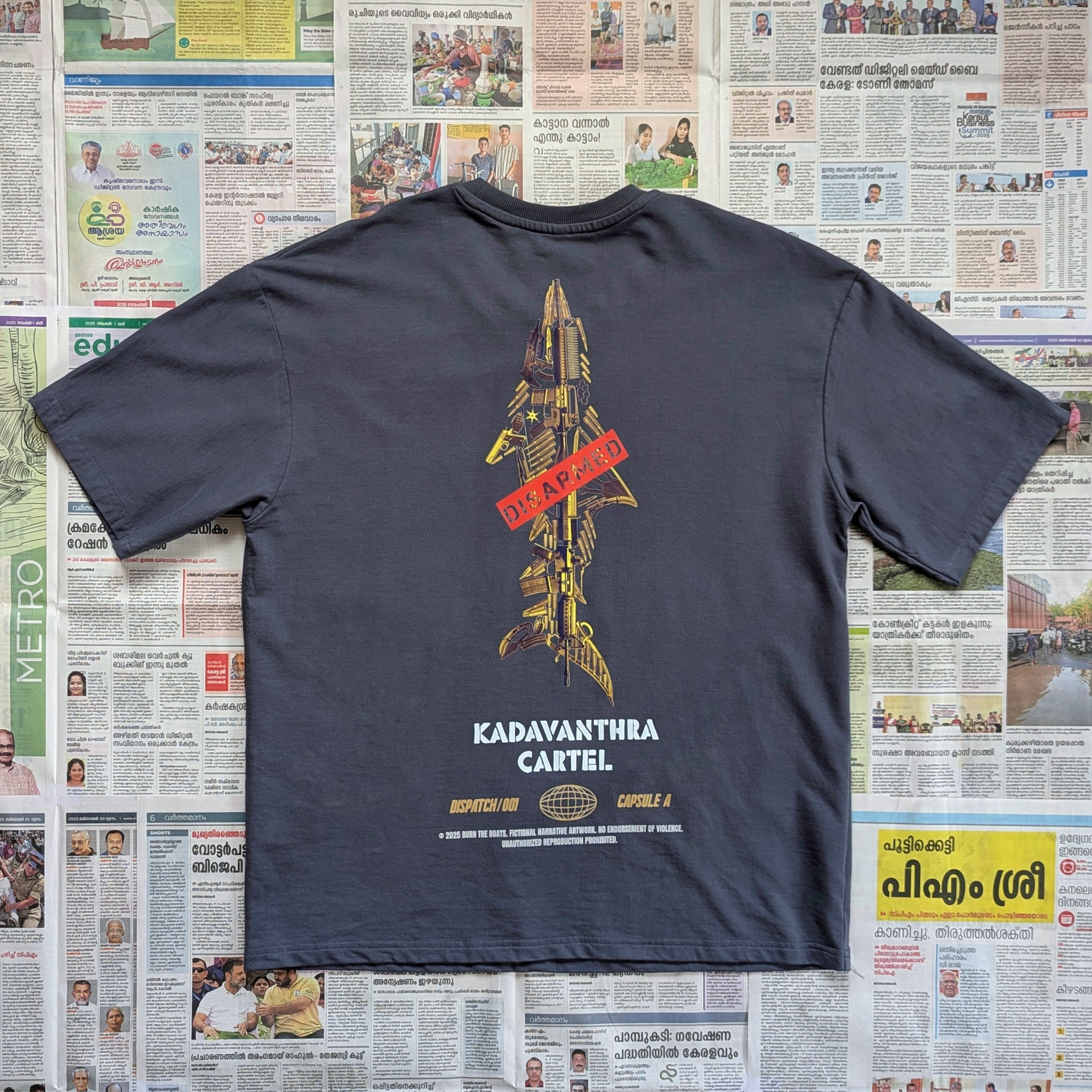 Grey t-shirt with full sized shark shaped weapons imagery
